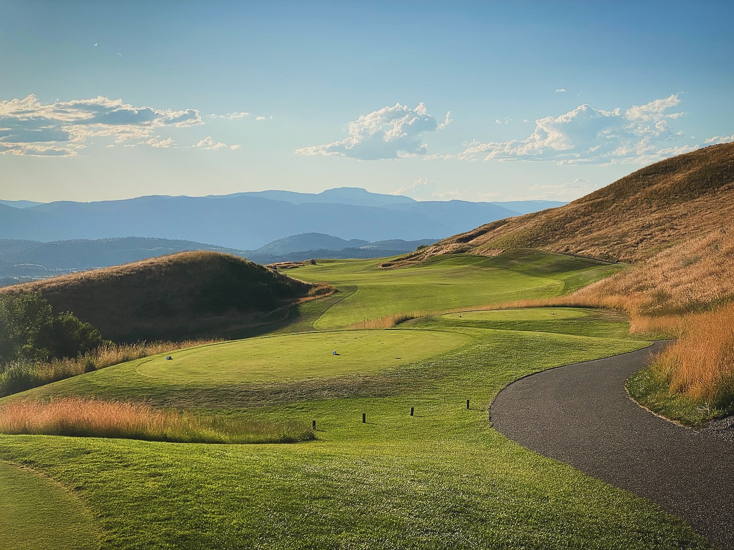Evening golf at Tower Ranch in Kelowna — a fairway rolling through the golden Okanagan hills